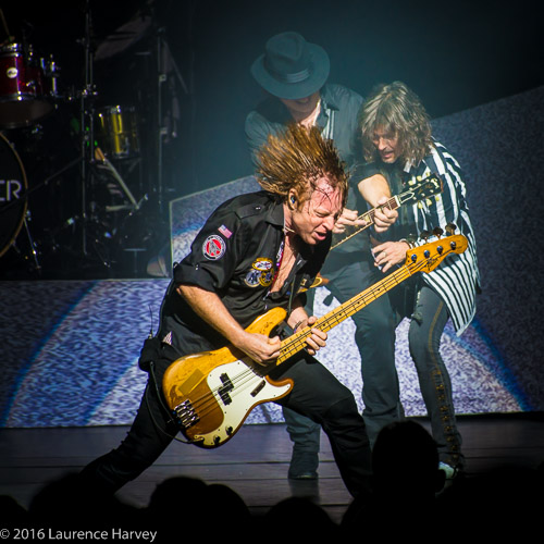 Jeff Pilson on bass, Kelly Hansen on lead vocals & Tom Gimbel on rhythm guitar