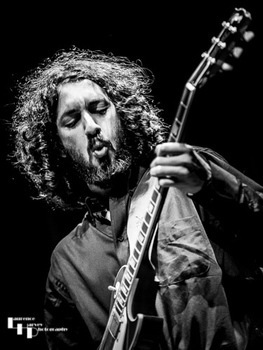 Kid Carlos on guitar