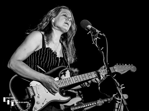 Clare Free on acoustic guitar and vocals