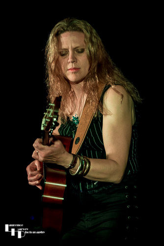 Clare Free on acoustic guitar
