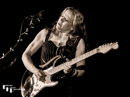 Clare Free on acoustic guitar and vocals