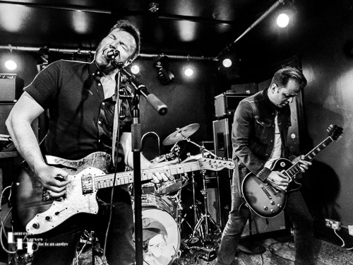 John Drake on lead vocals & guitar, Adam Mackie on lead guitar