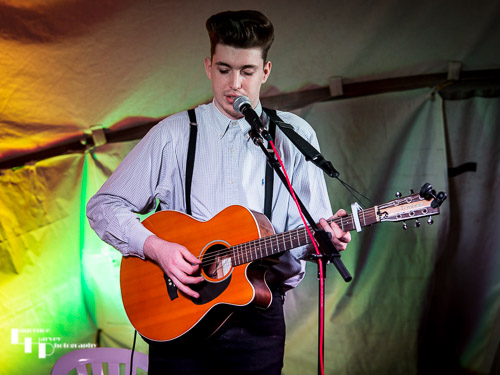 Tom McCartney on acoustic guitar