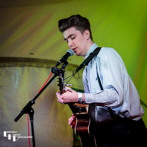 Tom McCartney on acoustic guitar