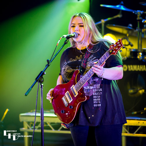 Tori Mai on rhythm guitar & vocals