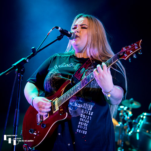 Tori Mai on rhythm guitar & vocals