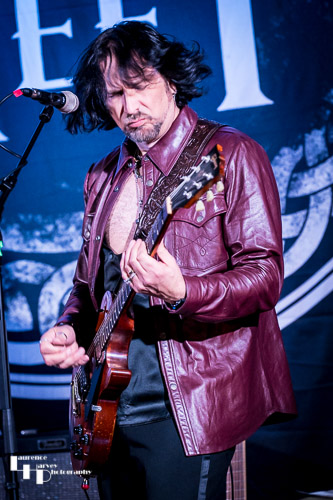 Aaron Bond on guitar