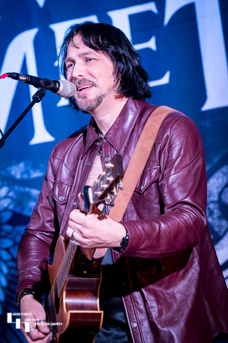 Aaron Bond on guitar & vocals