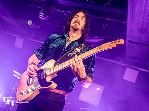 Aaron Bond on guitar & vocals