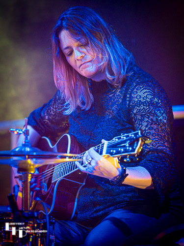 Donna Peters on acoustic guitar