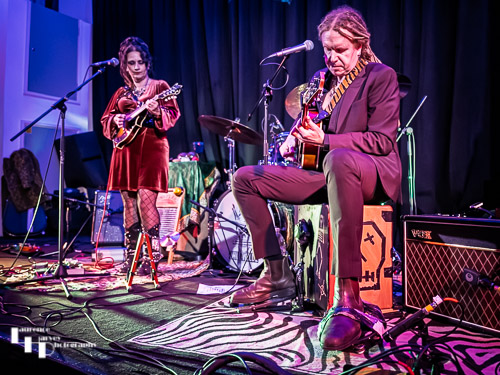 Jo Carley on vocals & mandolin, Tim Carley on guitar & kick drum