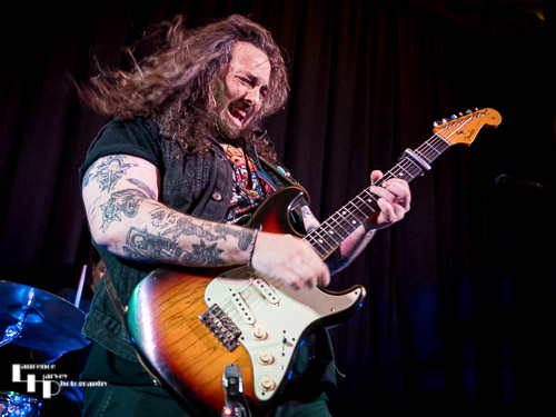 Aiden Pryor on guitar & vocals