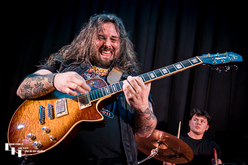 Aiden Pryor on guitar & vocals