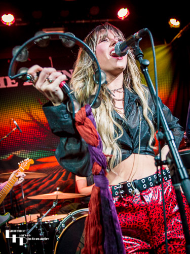 Megan Kane on guitar & vocals.