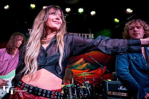 Megan Kane on guitar & vocals.