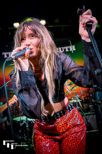 Megan Kane on guitar & vocals.