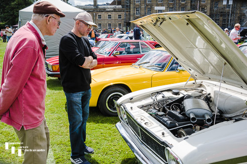 Interest in the engine compartment of an old Ford Cortina