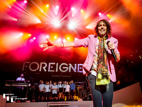 Foreigner on stage with their special guests, the choir of Notting Hill Preparatory School