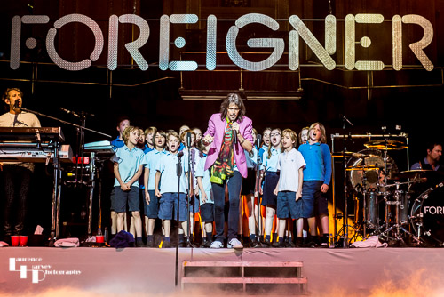 Foreigner on stage with their special guests, the choir of Notting Hill Preparatory School