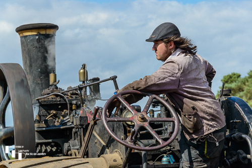 Traction engine driver in farm working demonstration